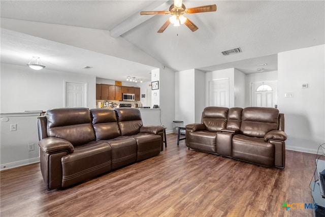 living room with vaulted ceiling with beams, ceiling fan, and dark wood-type flooring