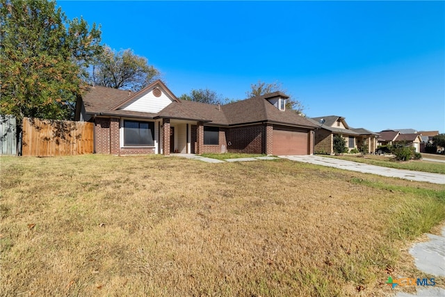 ranch-style home with a front lawn and a garage