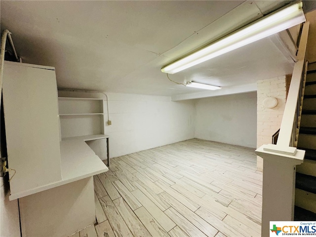 basement featuring light hardwood / wood-style floors