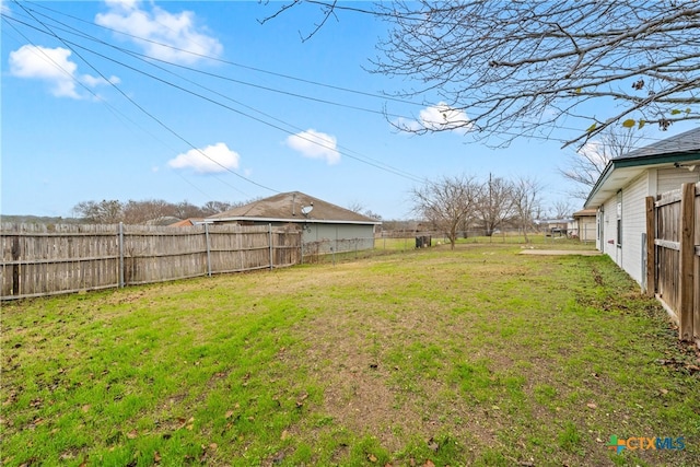 view of yard with a fenced backyard