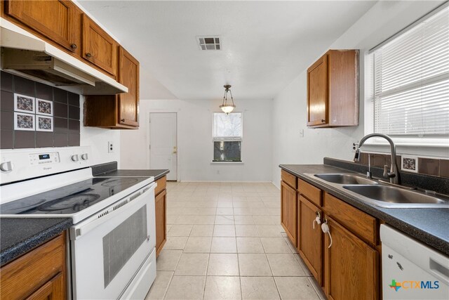 kitchen with sink and white appliances