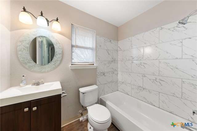 full bathroom featuring baseboards, toilet, shower / bathtub combination, wood finished floors, and vanity