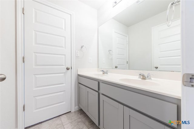 bathroom with double vanity and a sink