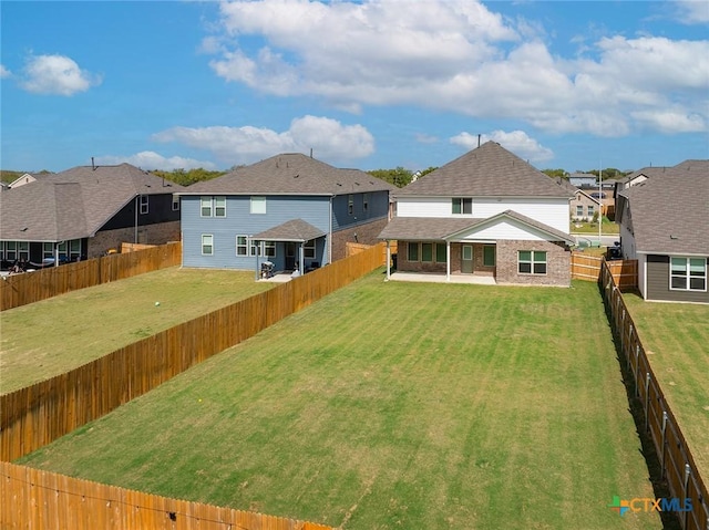 exterior space featuring a patio, a fenced backyard, and a residential view