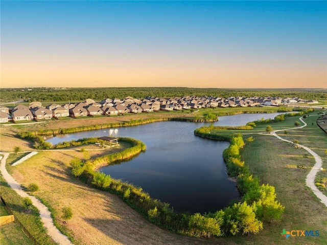 birds eye view of property featuring a residential view and a water view