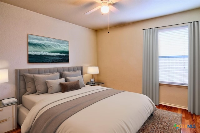 219 Starling Crk, New Braunfels, TX 78130 - bedroom featuring wood finished floors, baseboards, and ceiling fan