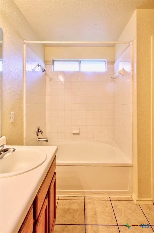 219 Starling Crk, New Braunfels, TX 78130 - full bathroom featuring vanity, healthy amount of natural light, shower / bath combination, and a textured ceiling