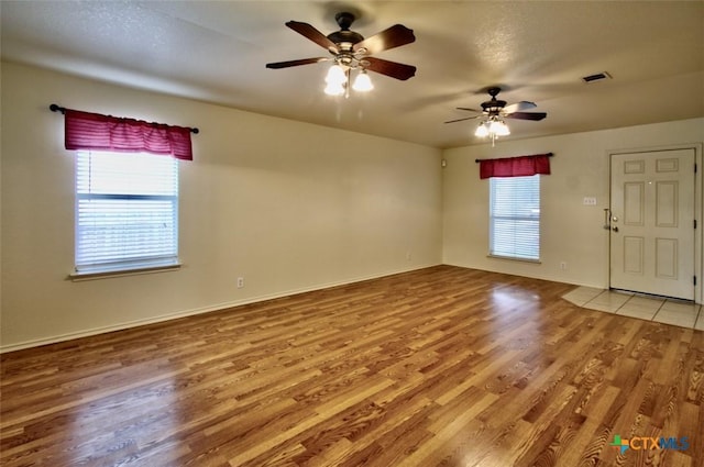 219 Starling Crk, New Braunfels, TX 78130 - empty room with light wood-type flooring, a ceiling fan, and baseboards