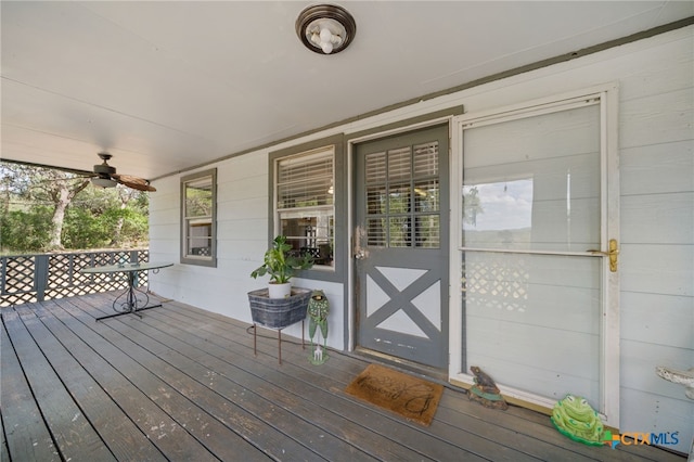 wooden deck featuring ceiling fan and a porch