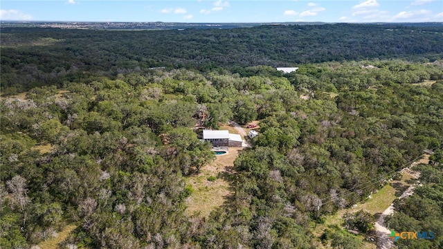 drone / aerial view with a view of trees