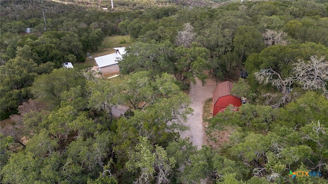 aerial view featuring a wooded view