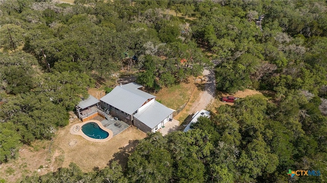 drone / aerial view with a view of trees