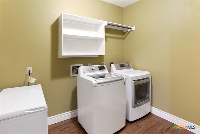 335 Mill Run, New Braunfels, TX 78132 - washroom featuring washing machine and dryer and dark wood finished floors