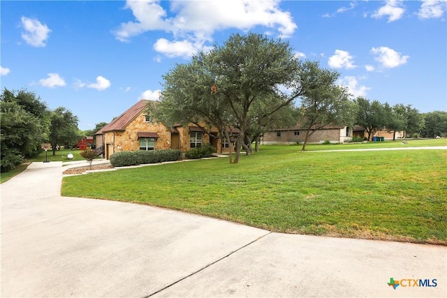 335 Mill Run, New Braunfels, TX 78132 - view of front of house featuring stone siding and a front yard