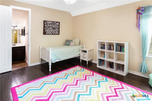 335 Mill Run, New Braunfels, TX 78132 - bedroom featuring wood finished floors and connected bathroom