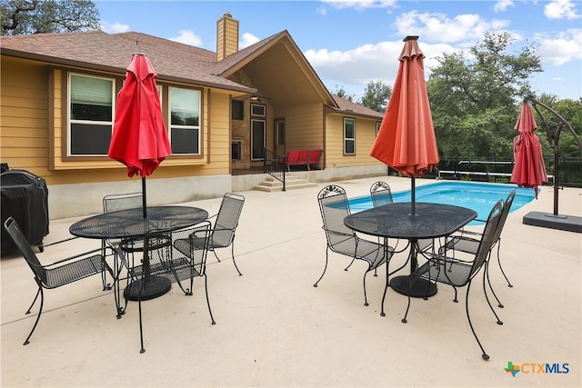 335 Mill Run, New Braunfels, TX 78132 - view of patio / terrace featuring outdoor dining area and grilling area