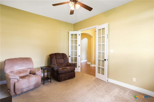 335 Mill Run, New Braunfels, TX 78132 - sitting room featuring french doors, arched walkways, carpet, and a ceiling fan