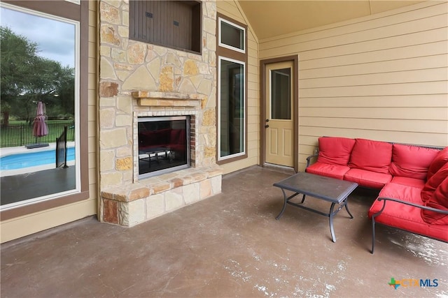 335 Mill Run, New Braunfels, TX 78132 - view of patio / terrace with an outdoor living space with a fireplace