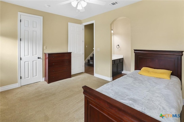 335 Mill Run, New Braunfels, TX 78132 - carpeted bedroom with ceiling fan and arched walkways