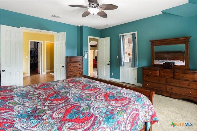 335 Mill Run, New Braunfels, TX 78132 - bedroom with ceiling fan and wood finished floors