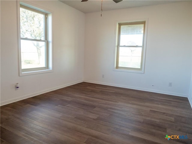 unfurnished room with ceiling fan, dark hardwood / wood-style flooring, and a healthy amount of sunlight