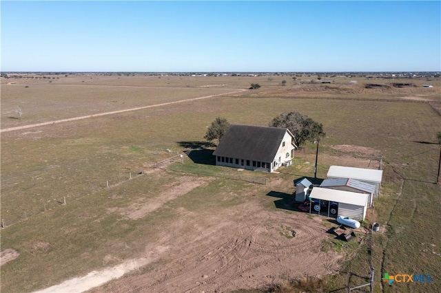 birds eye view of property with a rural view