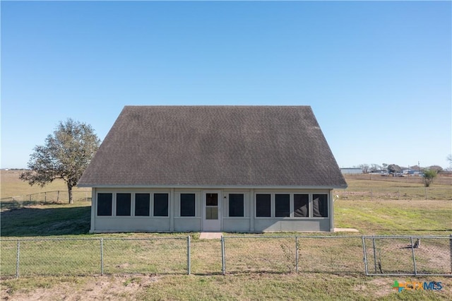 exterior space with a rural view and a lawn