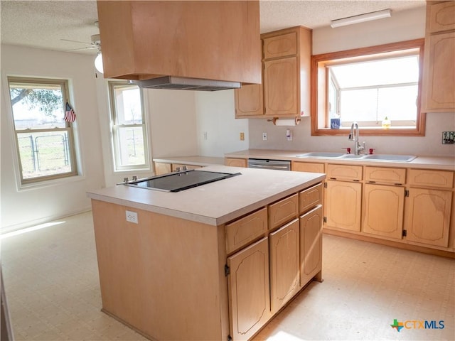 kitchen with light brown cabinetry, dishwasher, sink, and custom range hood