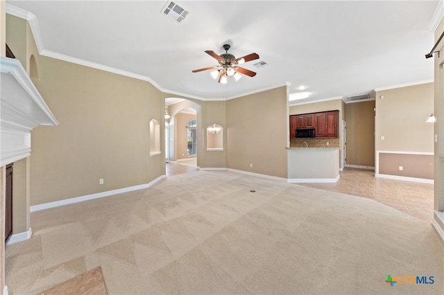 unfurnished living room featuring ceiling fan, light colored carpet, and ornamental molding