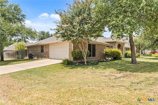 ranch-style home featuring a garage, a front lawn, and central AC