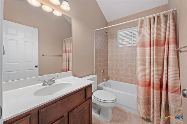 full bathroom with lofted ceiling, toilet, tile patterned floors, vanity, and shower / bath combination with curtain