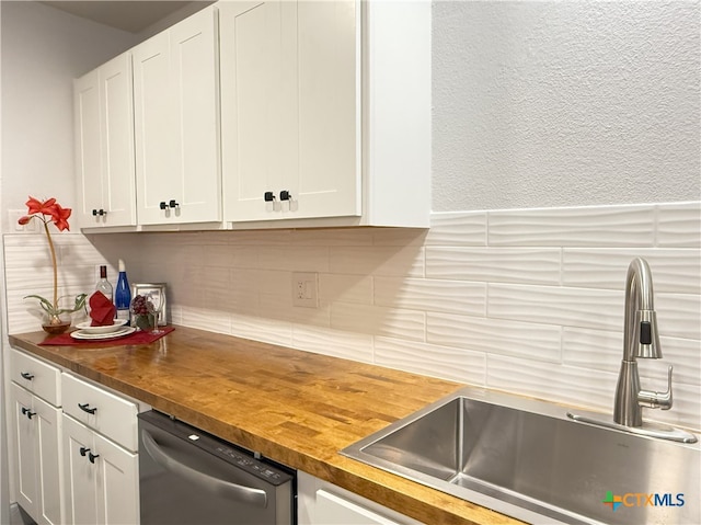 kitchen with wooden counters and white cabinets