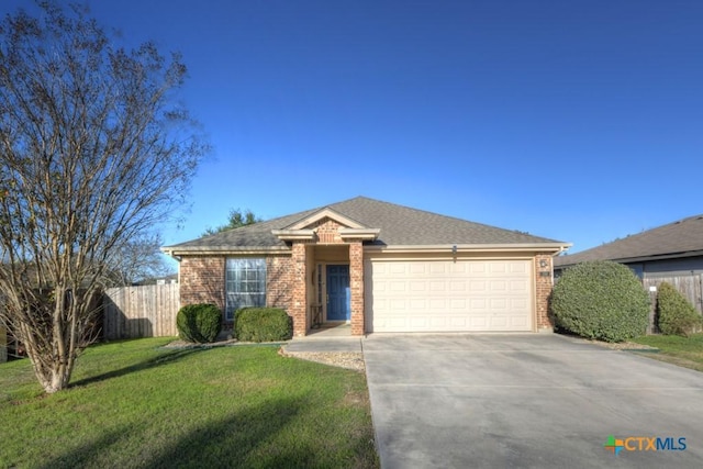 ranch-style house with a front yard and a garage