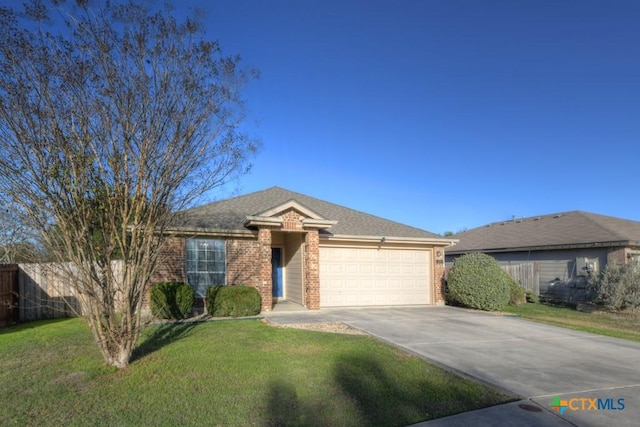 ranch-style home with a garage and a front yard