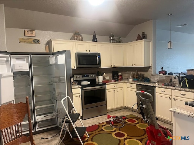 355 Primrose Way, New Braunfels, TX 78132 - kitchen featuring appliances with stainless steel finishes, vaulted ceiling, light stone counters, white cabinetry, and pendant lighting