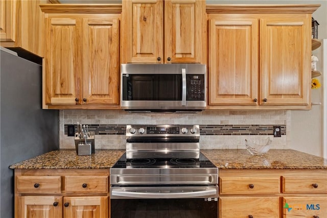2656 Snow Rd, Kempner, TX 76539 - kitchen with appliances with stainless steel finishes, backsplash, and stone countertops