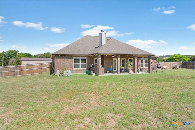 2656 Snow Rd, Kempner, TX 76539 - rear view of property featuring a patio area, brick siding, a chimney, and roof with shingles