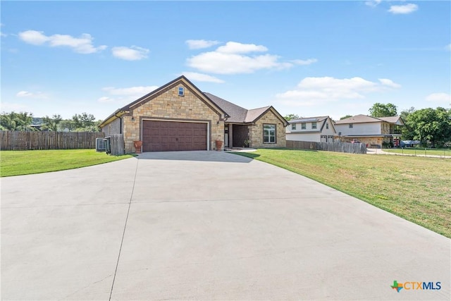 2656 Snow Rd, Kempner, TX 76539 - view of front facade featuring driveway, a garage, stone siding, and central AC