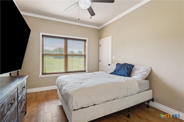 2656 Snow Rd, Kempner, TX 76539 - bedroom with baseboards, wood finished floors, ornamental molding, and a ceiling fan