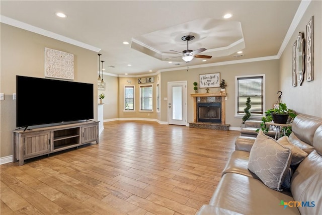 2656 Snow Rd, Kempner, TX 76539 - living room with plenty of natural light, a ceiling fan, a tray ceiling, light wood-type flooring, and recessed lighting