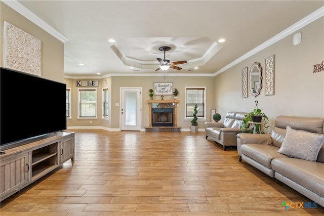 2656 Snow Rd, Kempner, TX 76539 - living area featuring a tray ceiling, light wood finished floors, a fireplace, a ceiling fan, and recessed lighting