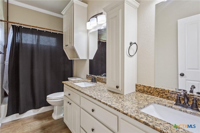 2656 Snow Rd, Kempner, TX 76539 - full bathroom featuring double vanity, wood finished floors, ornamental molding, toilet, and a shower with curtain