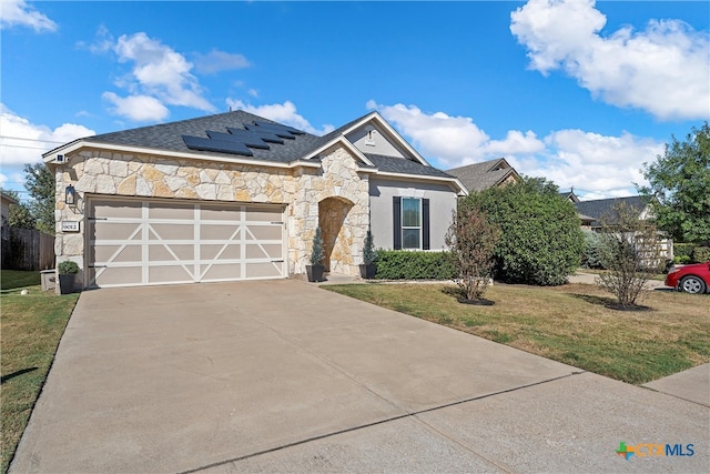 view of front facade with a garage and a front yard