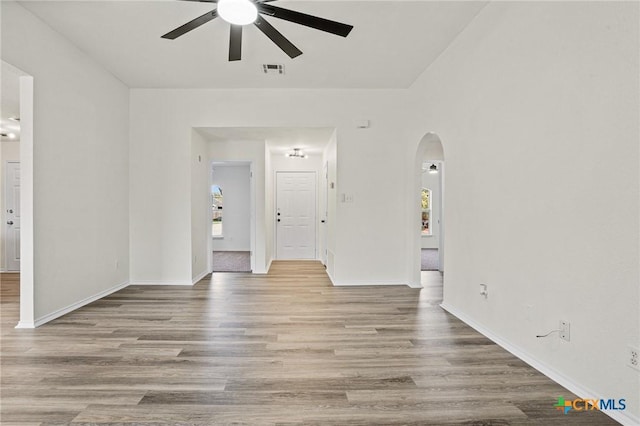 spare room featuring ceiling fan and light hardwood / wood-style flooring