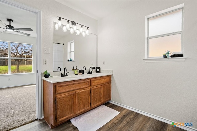 bathroom featuring vanity, ceiling fan, and hardwood / wood-style flooring