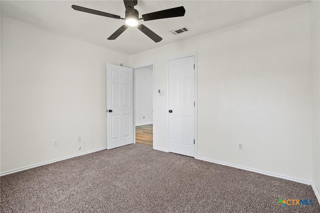 unfurnished bedroom with carpet floors and ceiling fan