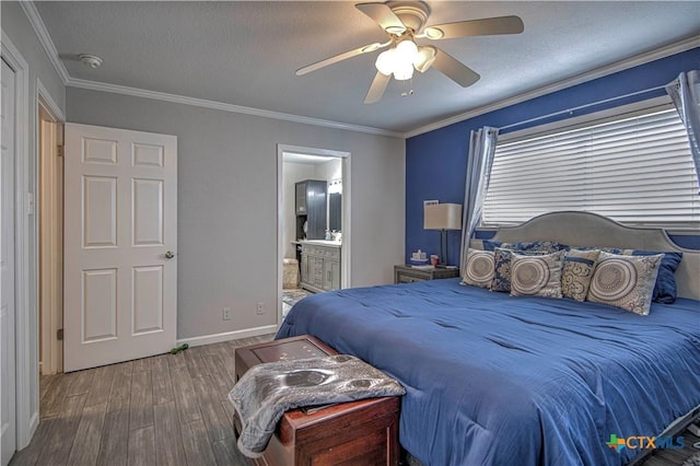 bedroom with hardwood / wood-style floors, ornamental molding, and a textured ceiling