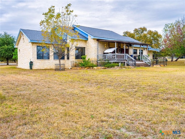 2904 Candace Cir, Horseshoe Bay, TX 78657 - view of front of home featuring stone siding, a front lawn, and covered porch
