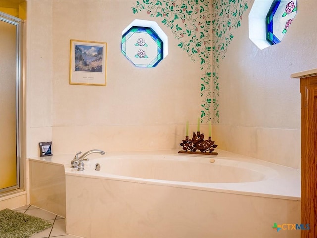 bathroom featuring tile patterned flooring and plus walk in shower