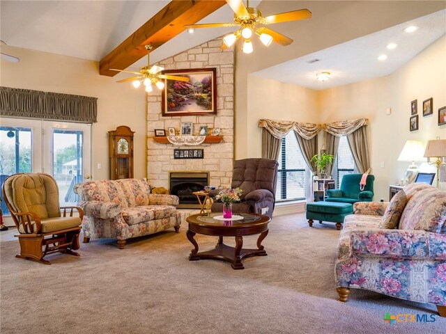 living room with beam ceiling, ceiling fan, a healthy amount of sunlight, high vaulted ceiling, and carpet